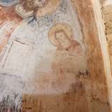 ...affiancato da san Giovanni Battista...